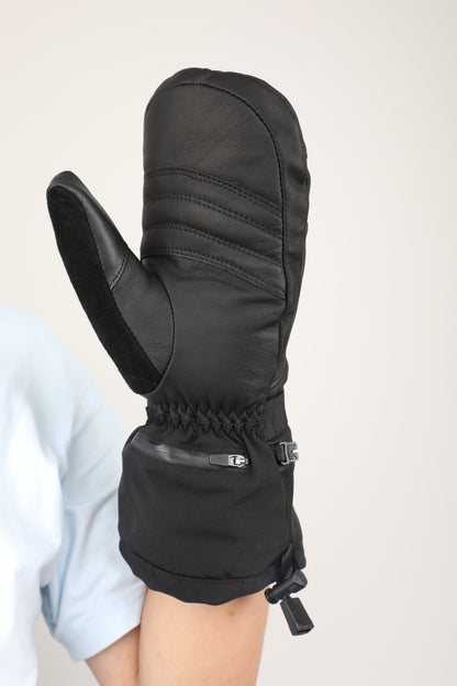 A single black winter mitten glove worn on a person's hand, shown against a plain light background. The glove has a smooth synthetic leather back, a black faux-leather palm, an elasticated wrist with a small zipper and silver buckle, and a drawcord closure at the cuff.