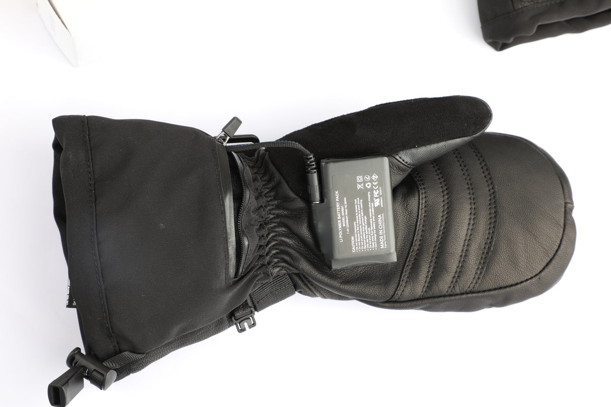 A black winter glove with a built-in power bank, shown on a white background with a small portion of another glove visible in the top right corner.