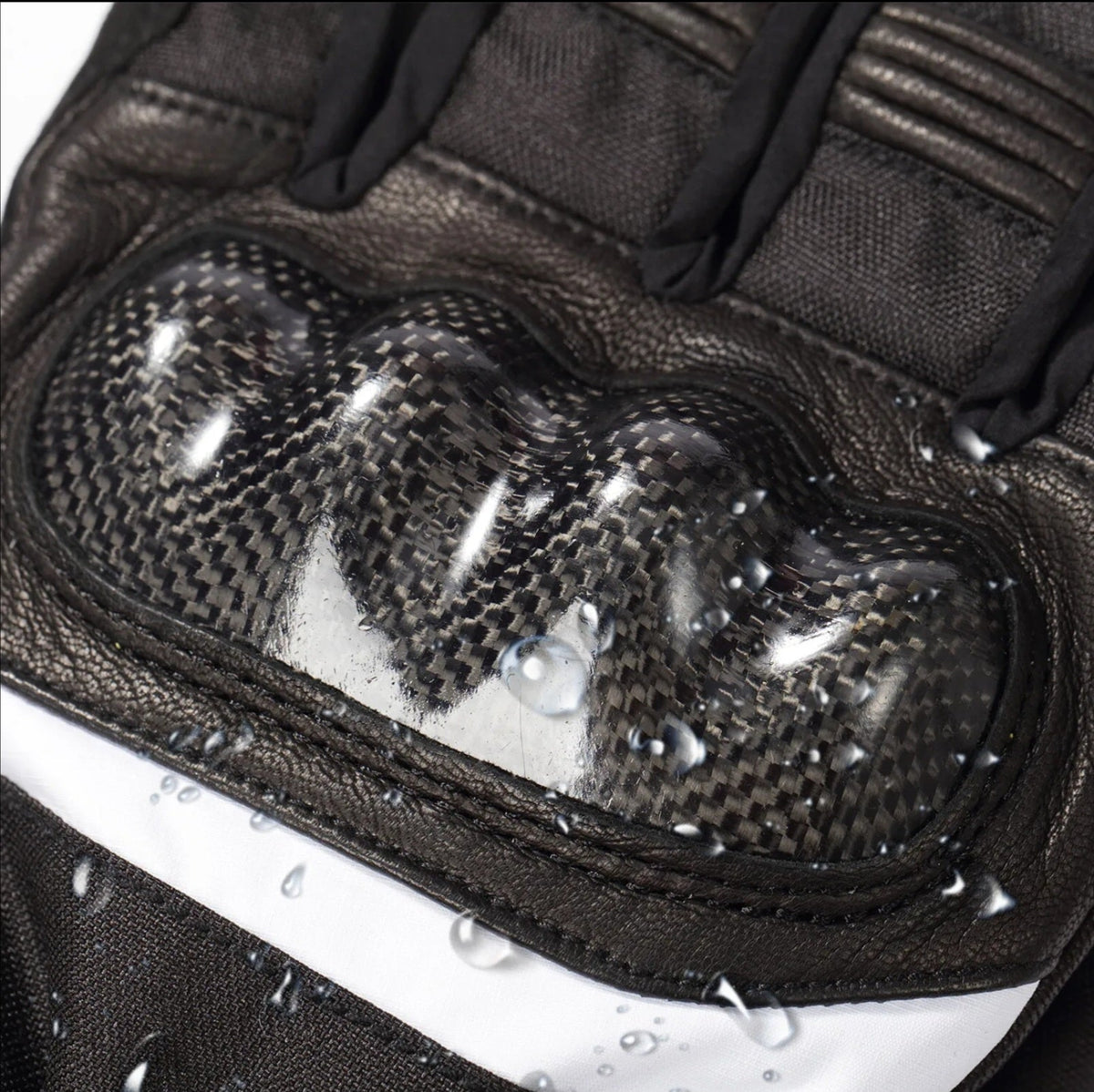 Carbon fibre knuckle guard beaded with rain on the MotoHeat Carbon.